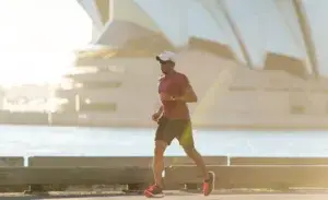 Runner training for a marathon near Sydney Opera House, representing 10 weeks to train for a marathon.