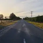 Empty rural road at sunrise—ideal example for running against traffic safety