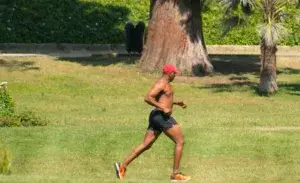 200lb male runner training in the park during marathon prep.