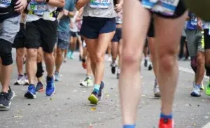 Runners participating in one of the most beautiful marathons in the US, showcasing a vibrant race atmosphere and diverse participants.