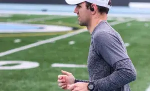 Runner wearing a lightweight sweatshirt during a training session on a track