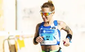 Female runner competing at Zurich Marathon Málaga, focused and strong, representing the determination required to achieve a 3 50 marathon pace.
