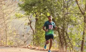 Runner during 3 mile run time on a forest trail