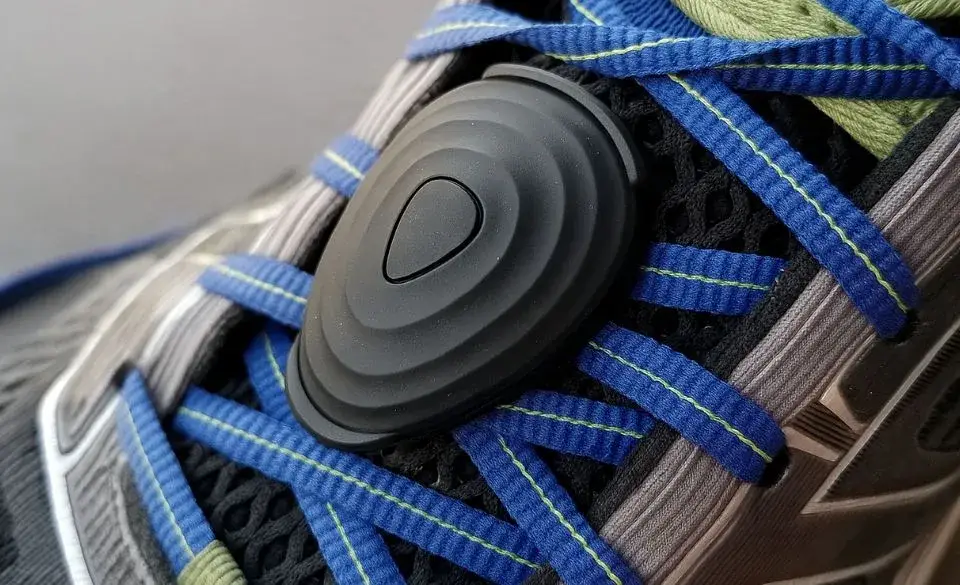 Close-up of a running power meter attached to shoelaces