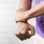 Person examining wrist size – why are my wrists so small.