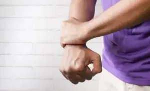 Person examining wrist size – why are my wrists so small.