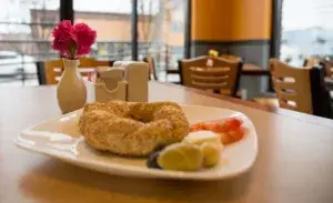 triathlon breakfast served with a bagel and fresh sides in a cozy cafe setting