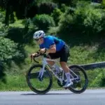 Cyclist leaning into a turn during morning vs evening cycling training session