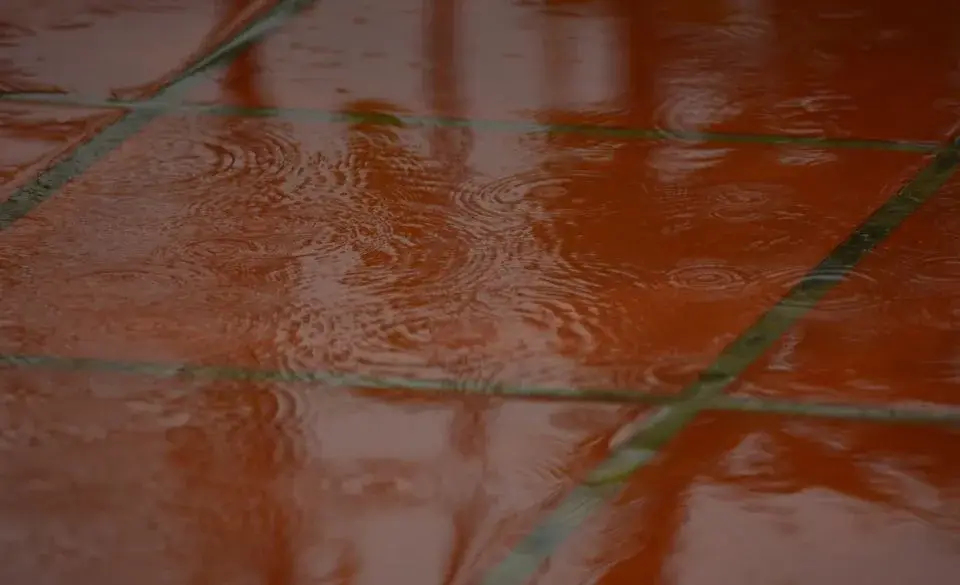 triathlon in the rain transition area with puddles forming on tiles