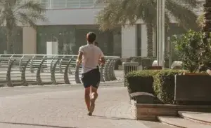 Runner with underpronation foot strike on a city path