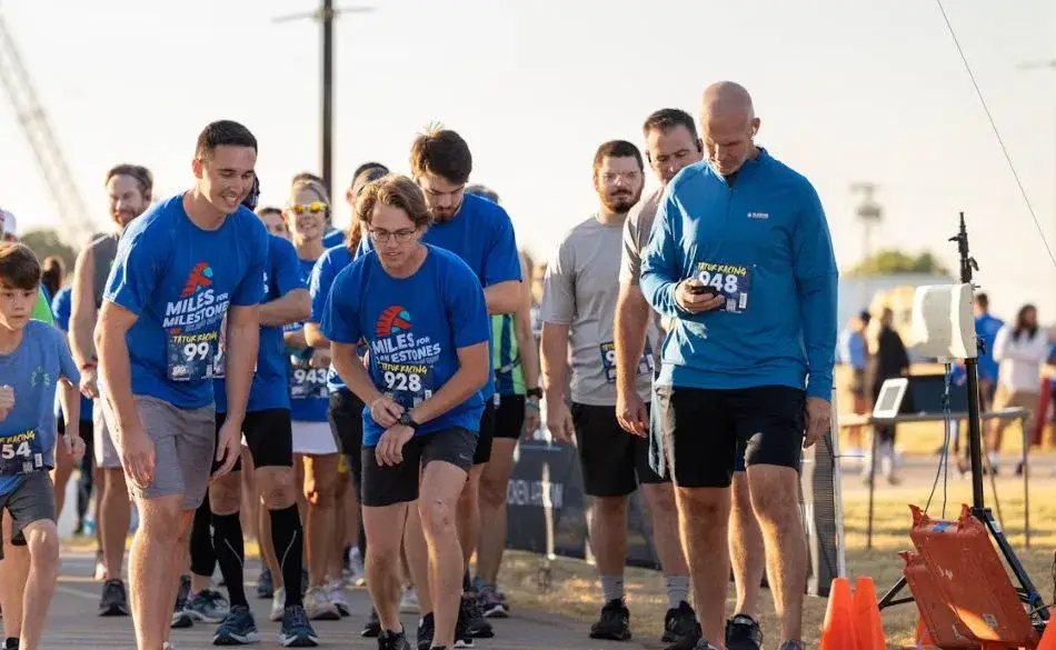 Runners at the start line of a local race training for a sub 40 10k.