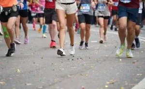 Runners participating in one of the best marathons in New Zealand 2025, surrounded by confetti on race day.