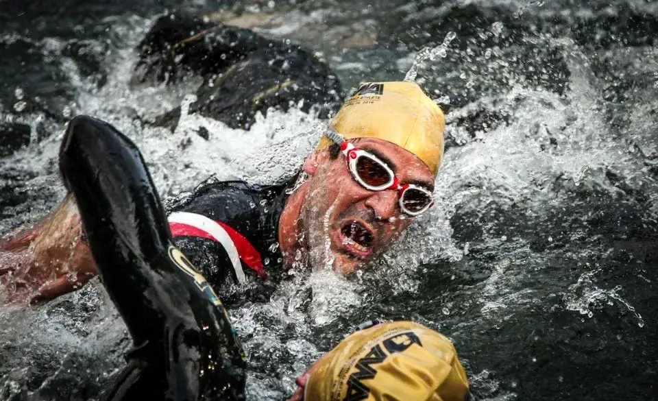 Half Ironman triathlon training program swim start chaos in open water.
