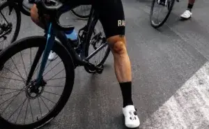 Cyclist showing defined leg muscles from regular cycling.