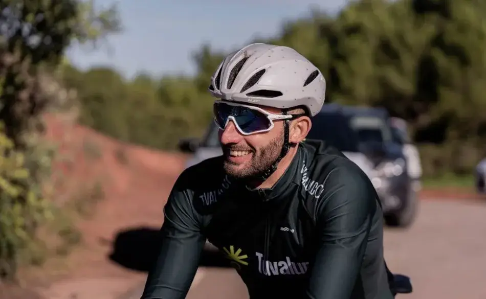 Smiling cyclist enjoying the benefits of cycling outdoors