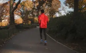 benefits of double run days runner on park trail