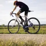 Cyclist pedaling outdoors while focusing on the best cadence for cycling