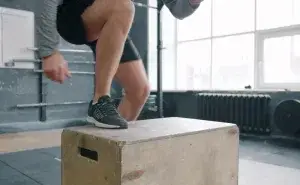 Cyclist performing step-up box drill as part of the best calf exercises for cyclists