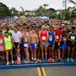 Runners lined up at the start of a 5K race, showing the excitement of how many miles is a 5km race