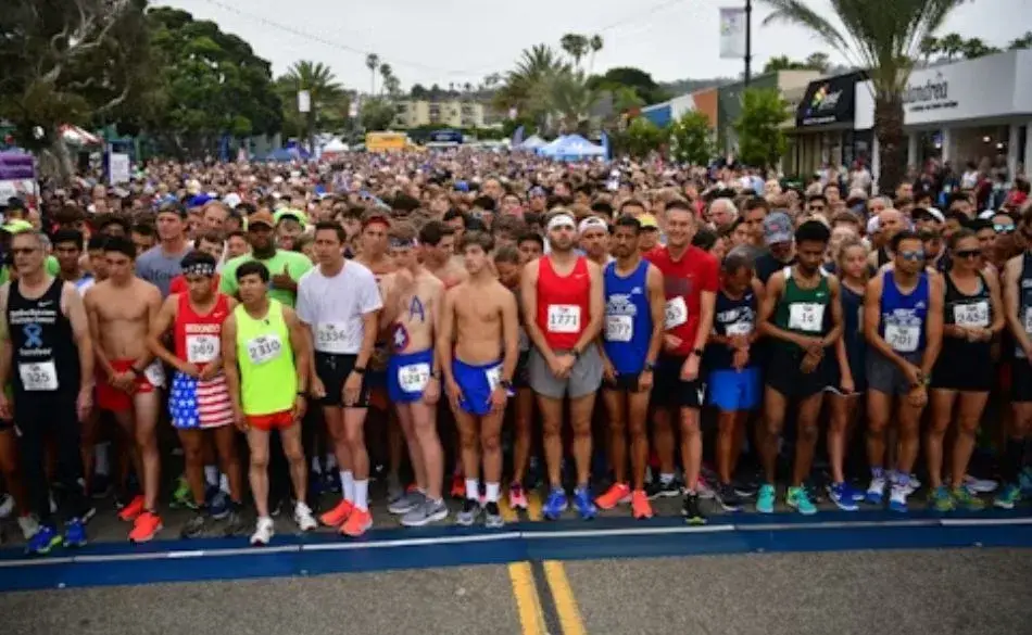 Runners lined up at the start of a 5K race, showing the excitement of how many miles is a 5km race