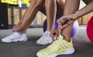 how to get back into exercise by lacing up running shoes and preparing for a workout