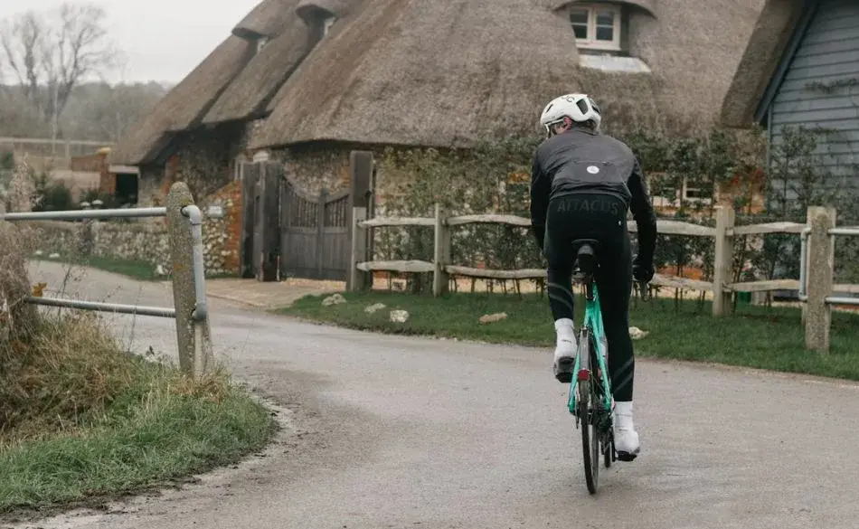 Cyclist training on rural road practicing how to improve cycling cadence