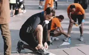 marathon running coach helping runners prepare for race