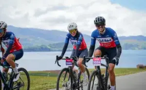 Cyclists riding outdoors while using a cycling kcal calculator to track calories burned