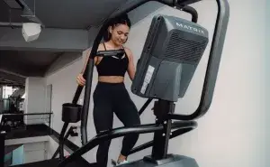 woman doing exercises to boost metabolism on stair climber