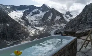How cold should an ice bath be for recovery, showing a mountain ice bath setup with freezing water and a peaceful endurance training atmosphere.