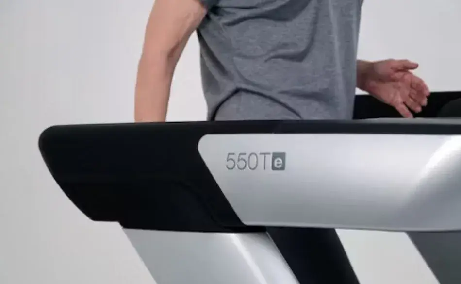 Person walking on treadmill during incline walking vs running workout