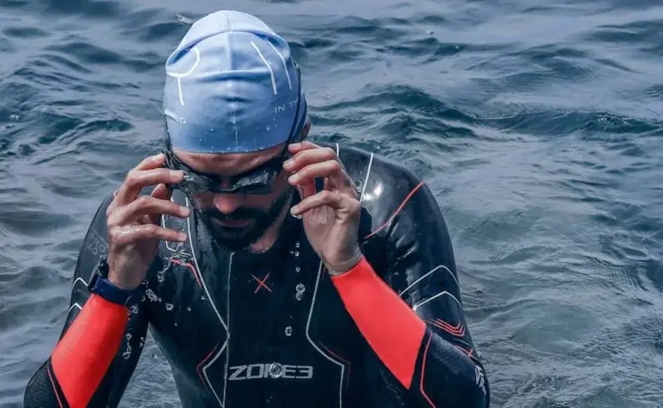 Ironman triathlon coach athlete training in open water