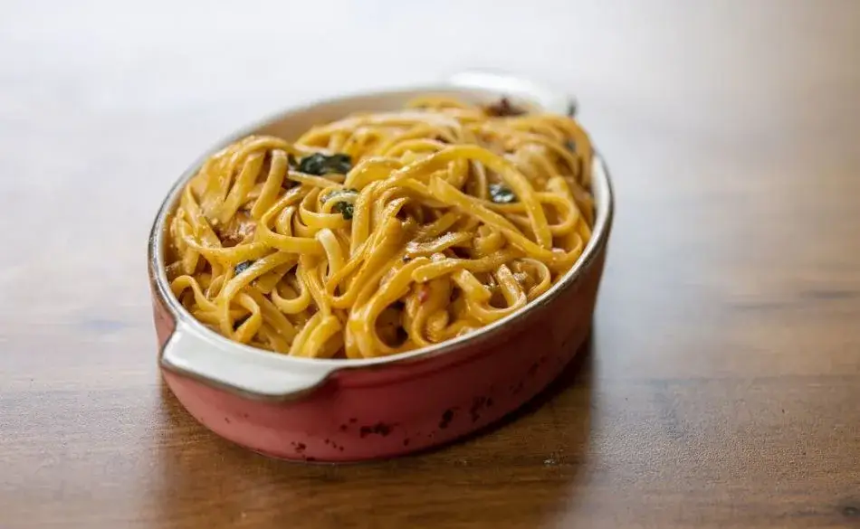A bowl of pasta showing what foods have a lot of carbohydrates for endurance athletes