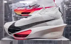 running shoes banned from marathon displayed on a stand during an athletics expo