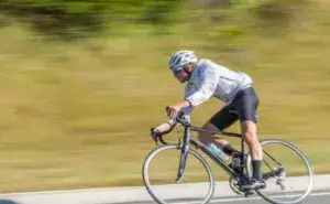 Best cycling drills example of a cyclist practicing speed and power on the road