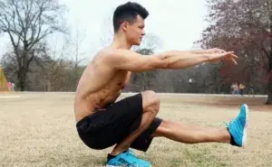 athlete performing a pistol squat one of the best quad exercises for runners