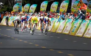 Cyclists performing a high-speed sprint finish, showcasing the best sprint workouts for cyclists