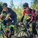 A group of cyclists cycling after a leg workout outside after a gym session