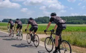 High Intensity Interval Training for Cyclists group riding on open road during summer training session