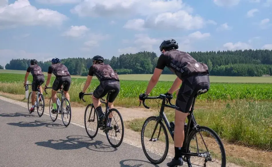 High Intensity Interval Training for Cyclists group riding on open road during summer training session