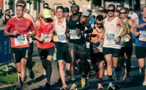 Runners finishing a race during a marathon, illustrating how soon after a marathon you can run again