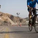 Cyclist training for a century ride on a mountain road