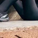 Athlete resting after a run as part of triathlon recovery tips