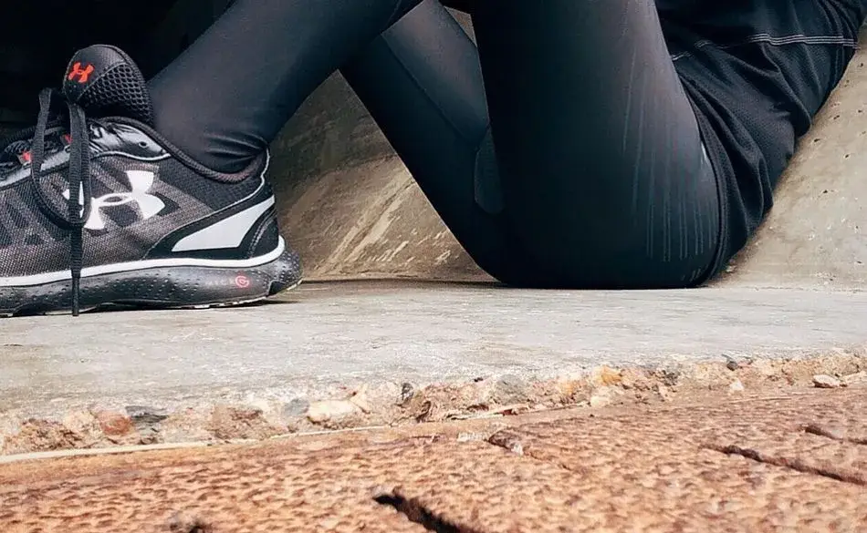 Athlete resting after a run as part of triathlon recovery tips