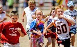 Kids running together during play, showing what age kids can start running for exercise in a fun, age-appropriate way