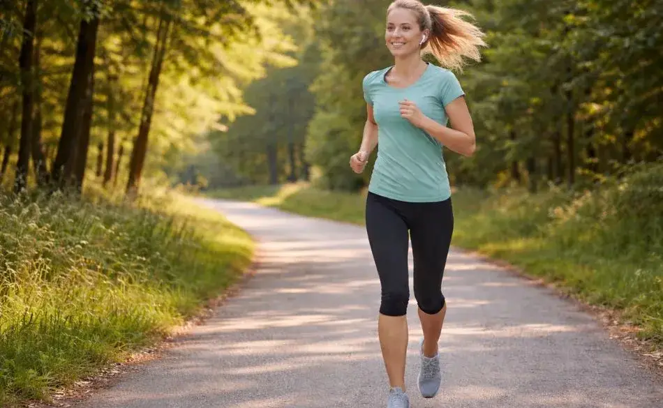 Beginner runner jogging outdoors showing an average time to run a mile for recreational runners