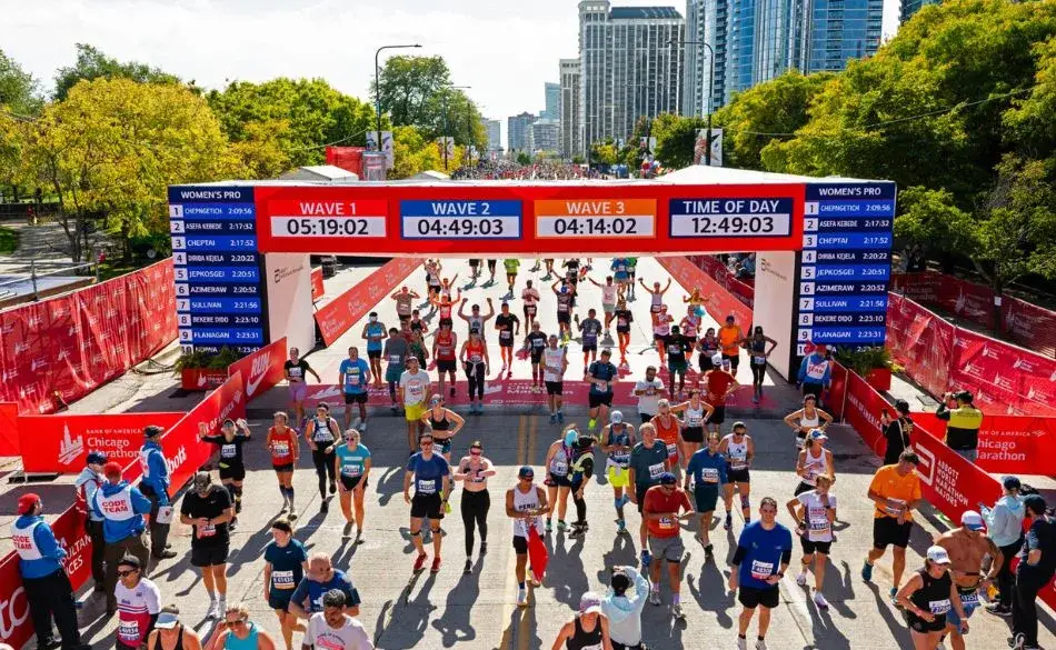 Chicago Marathon time qualification runners crossing the finish line