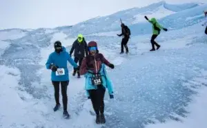 Runners competing in one of the coldest marathons in the world on icy terrain in extreme winter conditions
