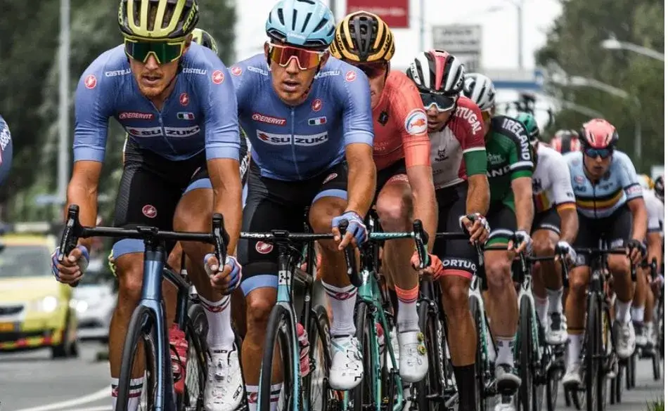 Group of cyclists racing during an endurance event showing how iron deficiency vs anemia in athletes can affect performance.