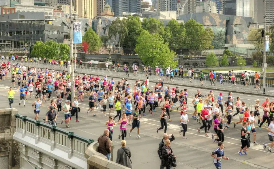 Marathon in Melbourne with runners crossing the city during race day